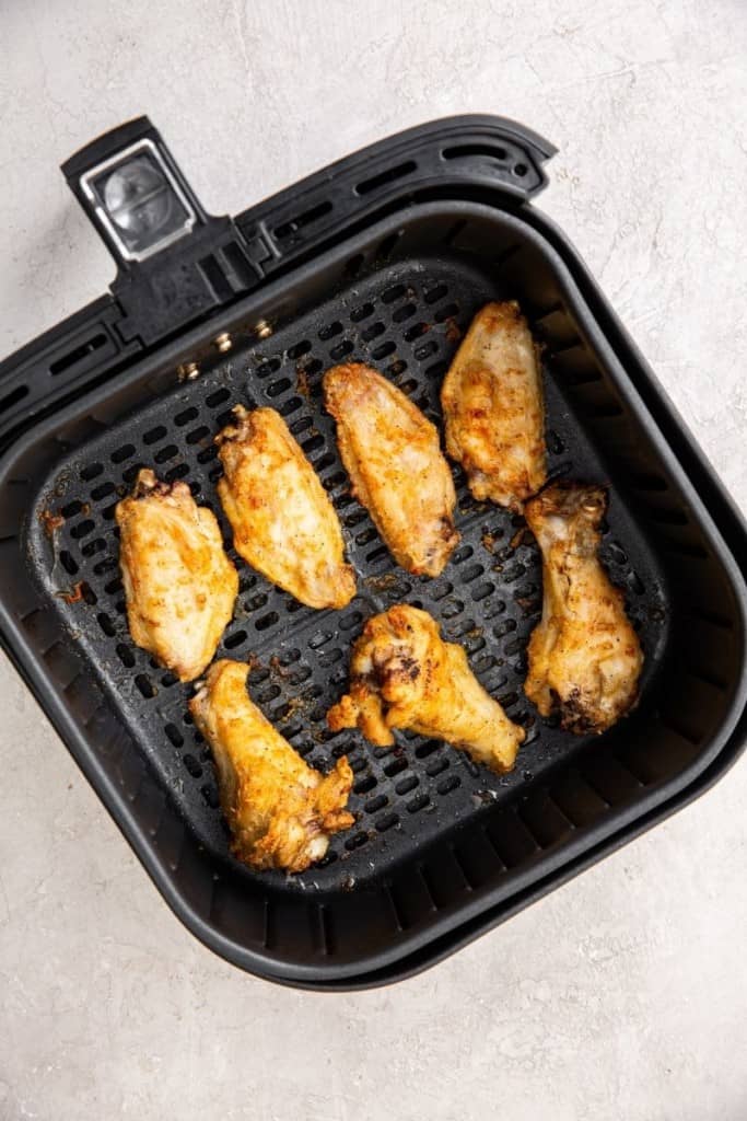 flip chicken wings over in air fryer to cook evenly