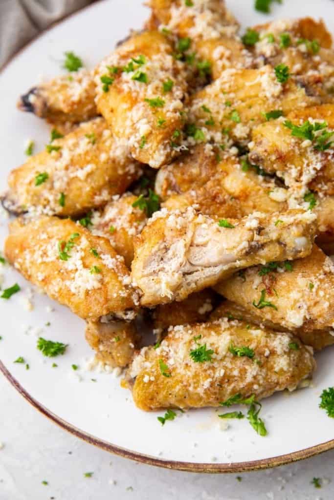 plate of fresh garlic parmesan wings cooked in air fryer