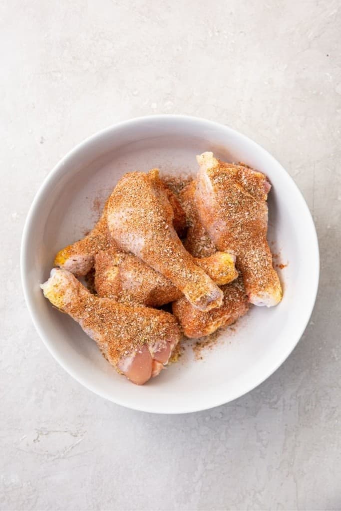 liberally coat drumsticks with seasonings