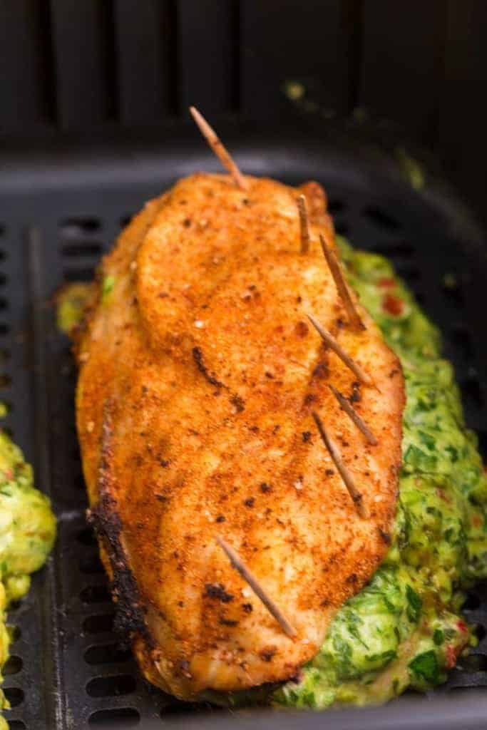 close up of stuffed chicken breast in air fryer