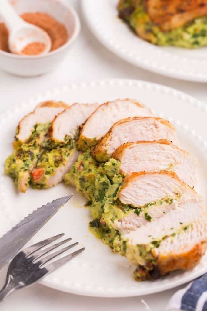 Sliced stuffed chicken breast cooked in air fryer on plate