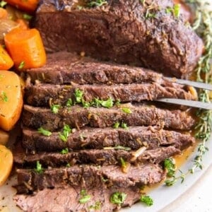 Sliced tri tip cooked in crock pot with vegetables