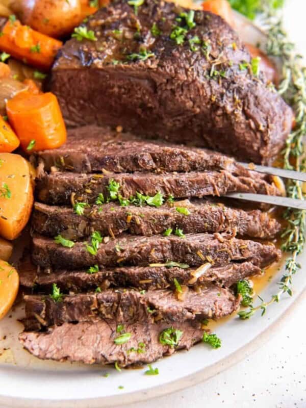 Sliced tri tip cooked in crock pot with vegetables