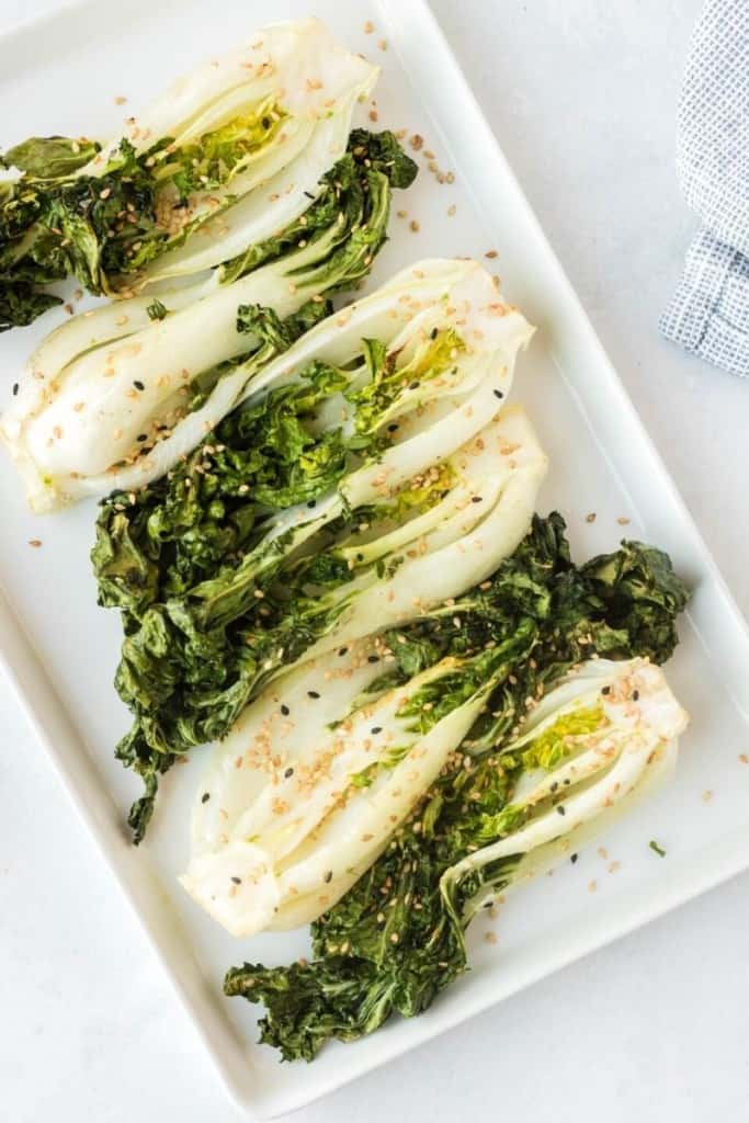 seasoned air fryer bok choy arranged on white platter