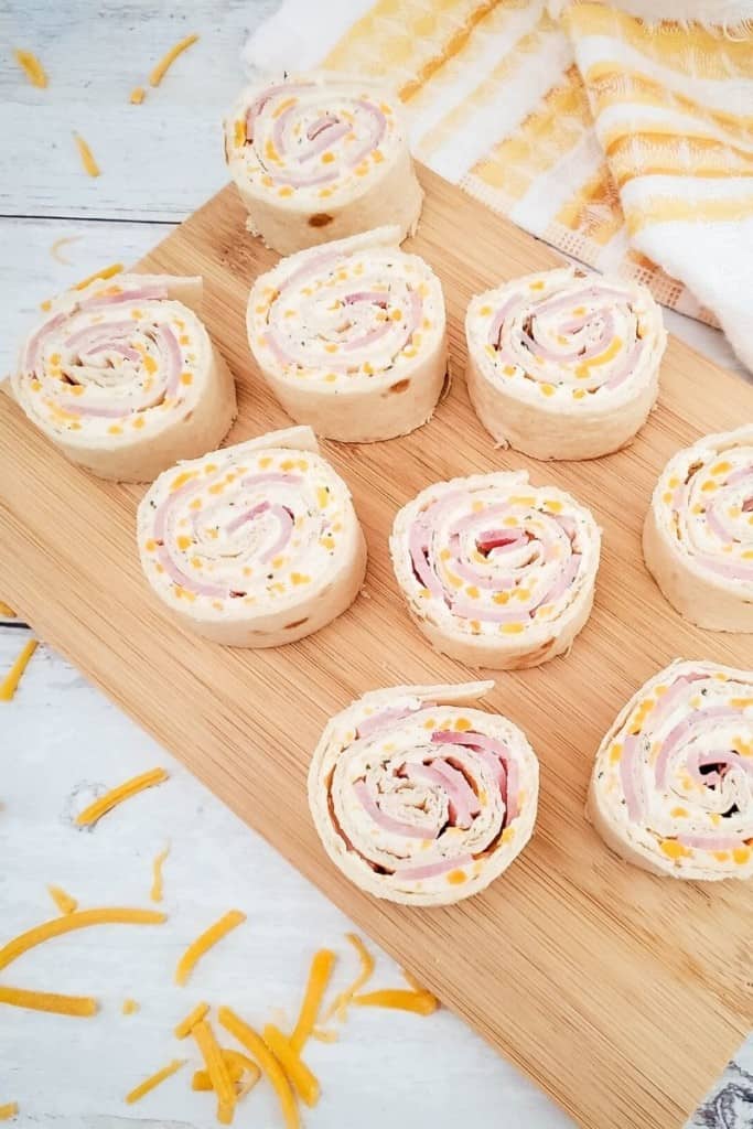 ham and cheese roll-ups on cutting board
