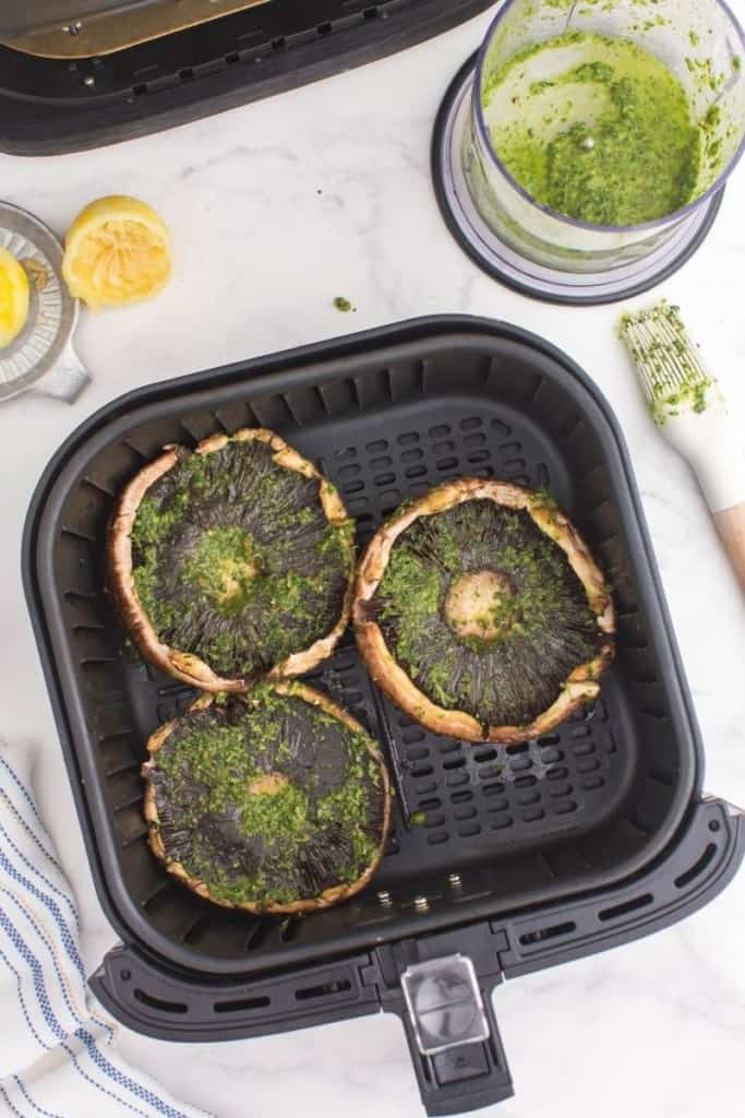 cook seasoned portobello mushrooms top-side down in air fryer