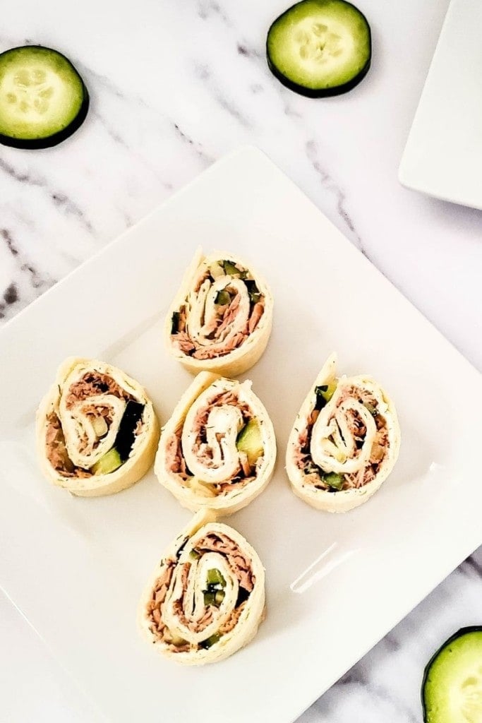 white plate with five tuna pinwheels