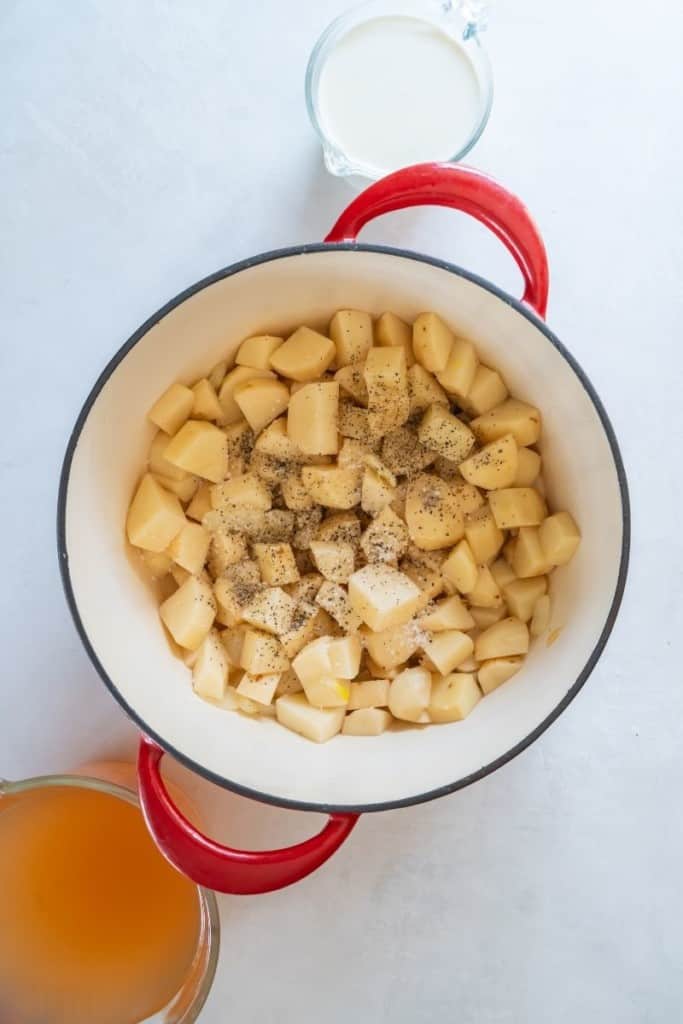 add sliced potatoes to Dutch oven