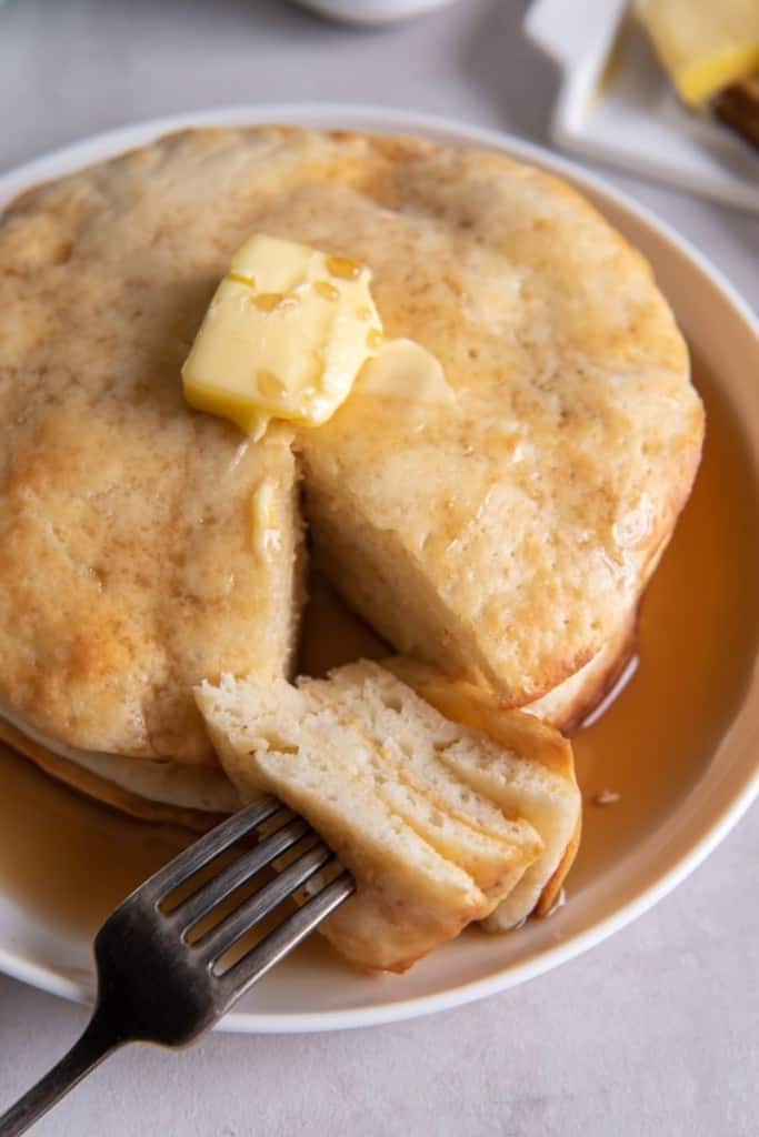 fork grabbing slices of air fryer pancakes