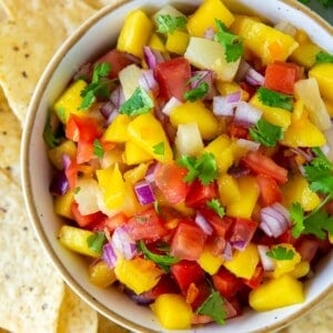 Overhead view of the salsa in a serving bowl with tortilla chips around it.