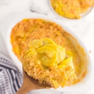 overhead view of spatula dishing up some squash casserole