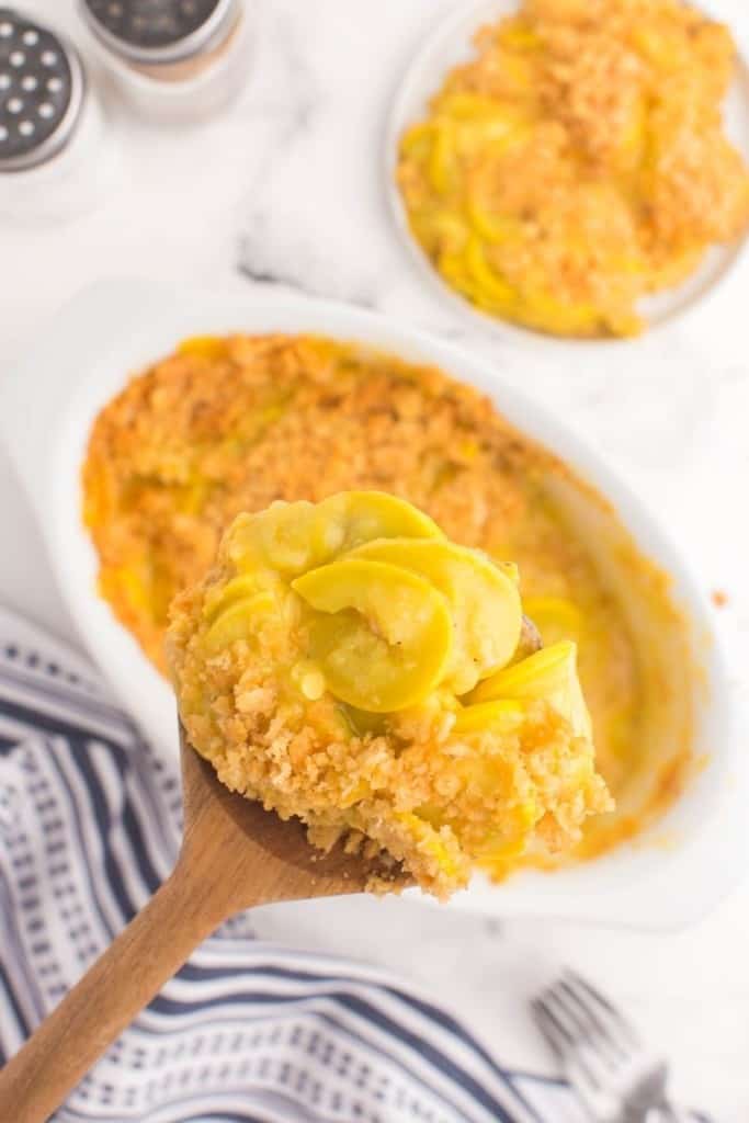 overhead view of spatula dishing up some squash casserole