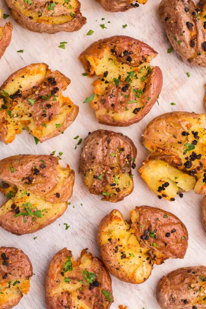 overhead view of several smashed potatoes