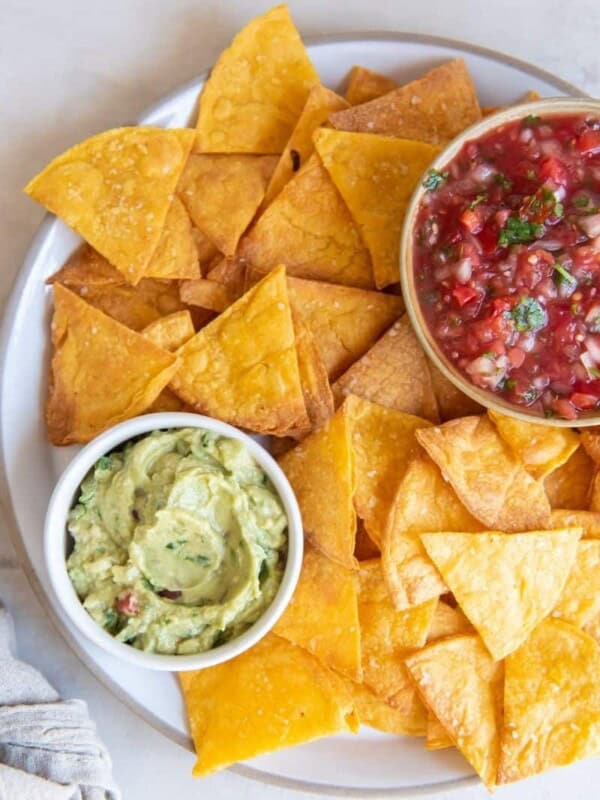 Homemade air fryer tortilla chips with guacamole and salsa