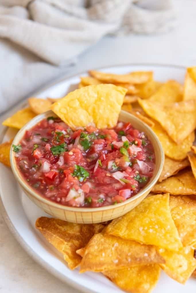 Close up of air fryer tortilla chips and fresh salsa