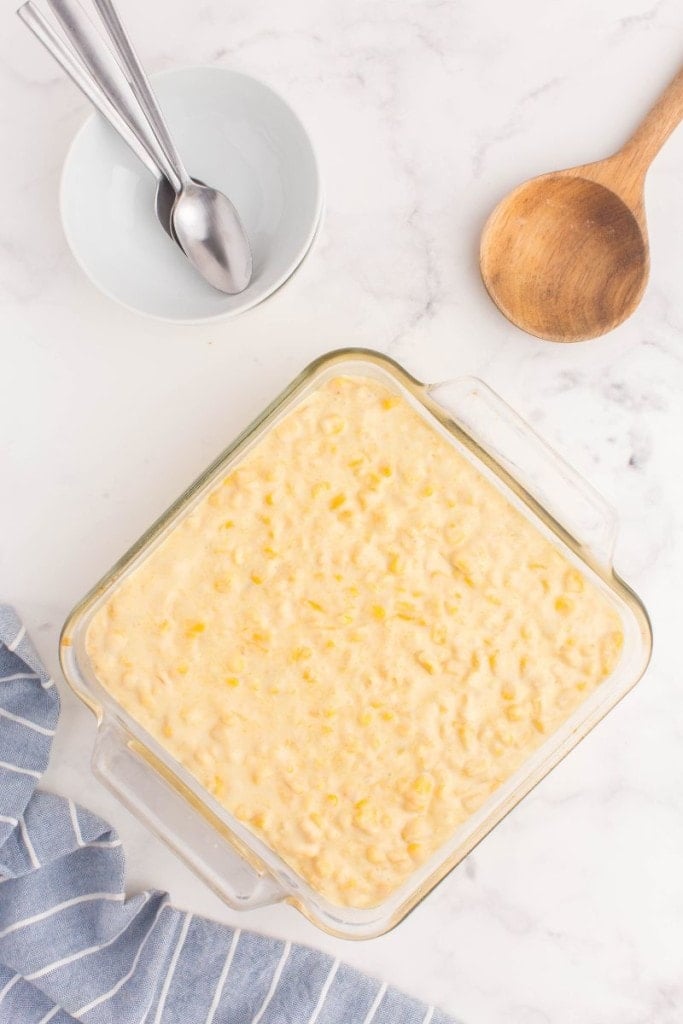 sweet corn casserole in a dish before being baked