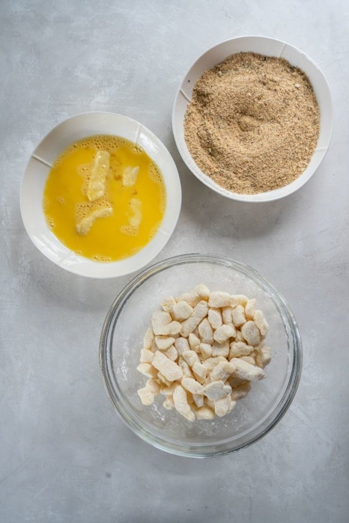 dipping cheese curds in egg mixture