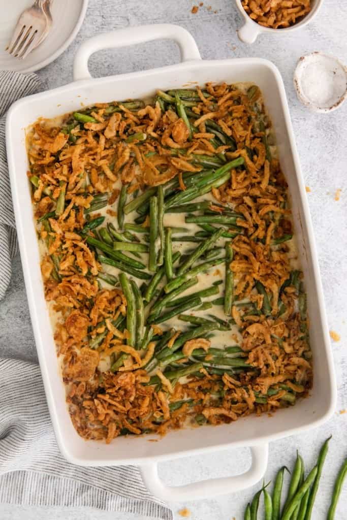 green bean casserole without mushroom soup in a white baking dish from overhead.