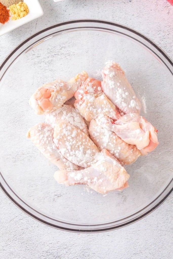bowl with raw chicken wings