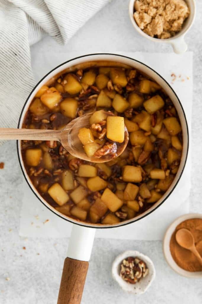 spoon with cinnamon roll apple pie filling