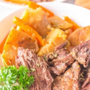 pot roast on a platter with potatoes