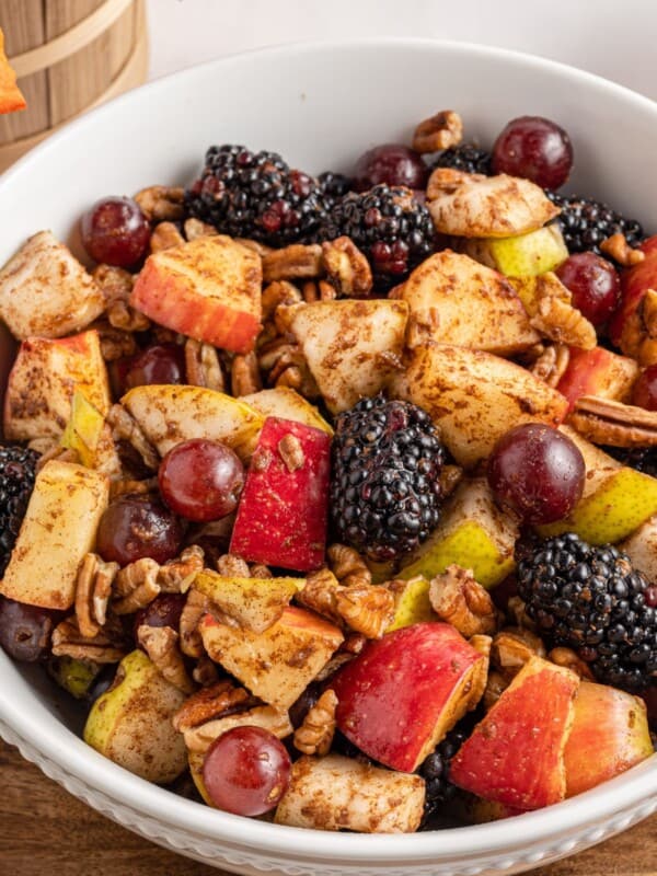 Close up of the Thanksgiving fruit salad in a white bowl.