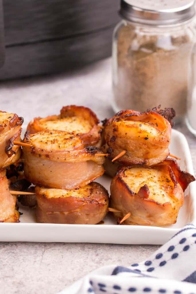 platter with scallops wrapped in bacon