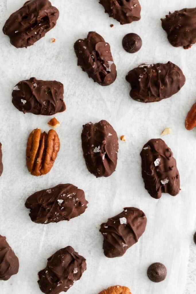 dark chocolate covered pecans with salt