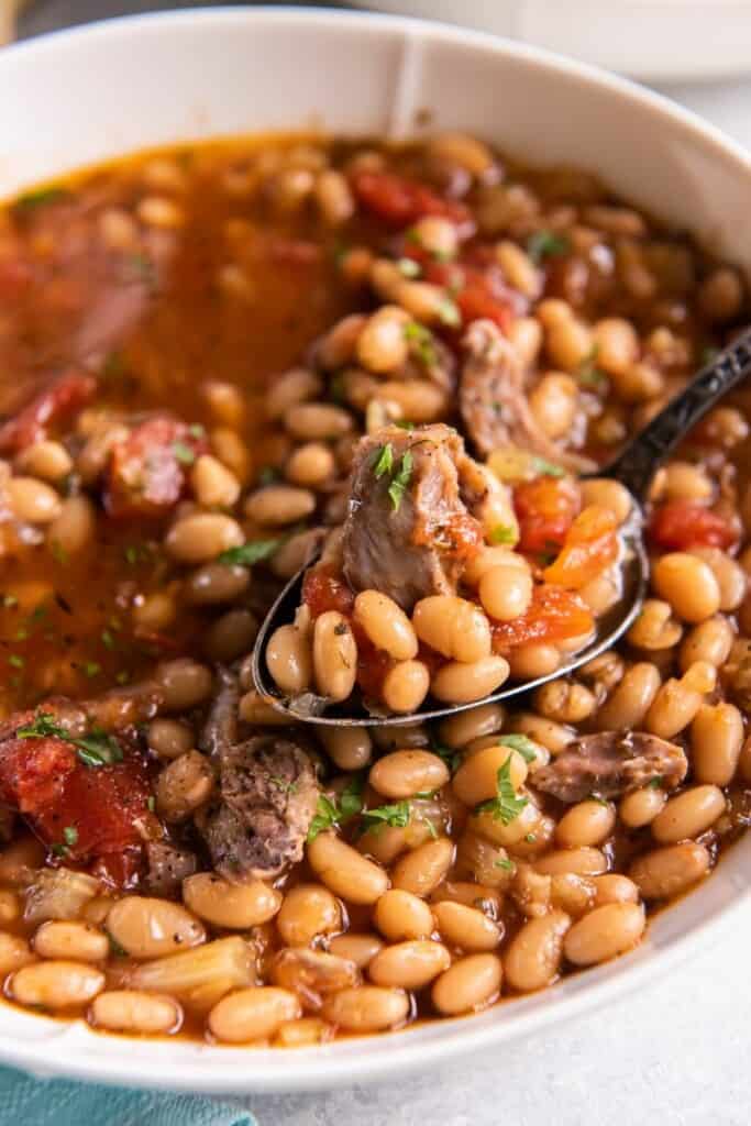 spoon holding bean soup
