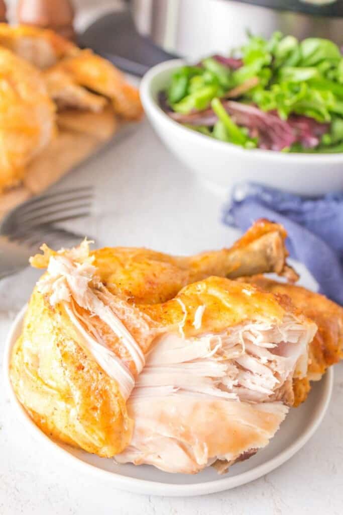 whole chicken on a white plate