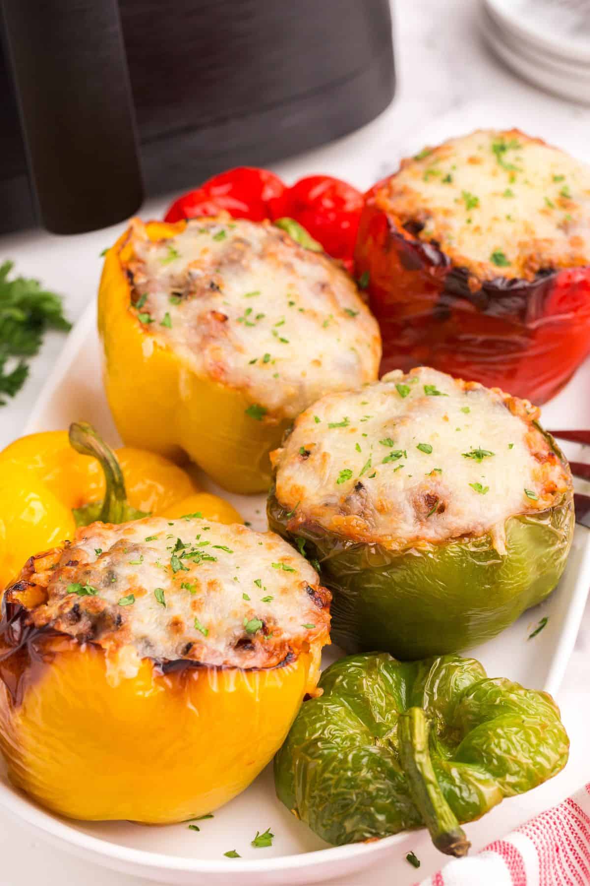 Air fryer stuffed peppers on a serving plate.