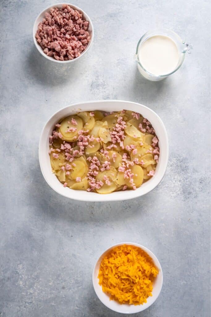 Scalloped potatoes and ham in a baking dish.