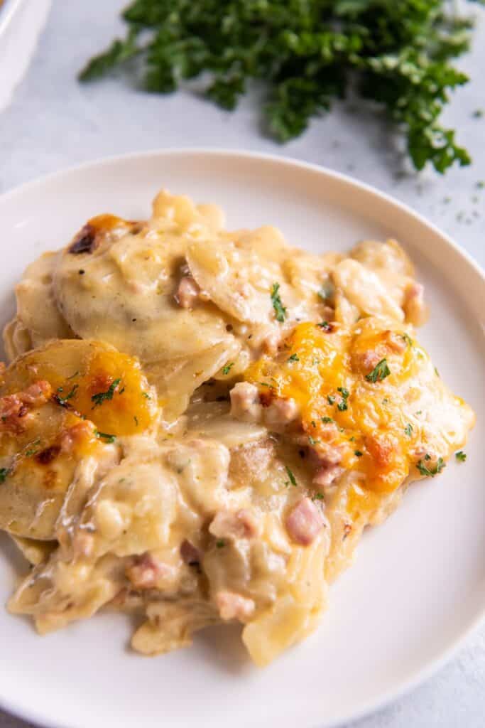 Instant Pot scalloped potatoes and ham on a plate.
