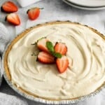 cheesecake with slices of strawberries