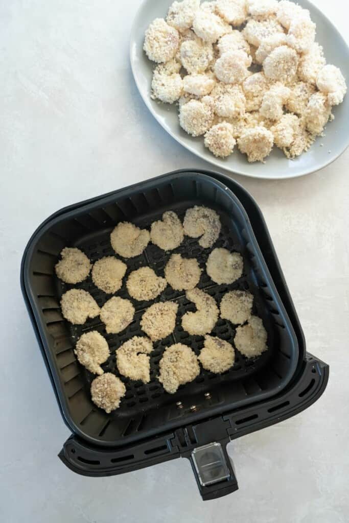battered shrimp in air fryer basket