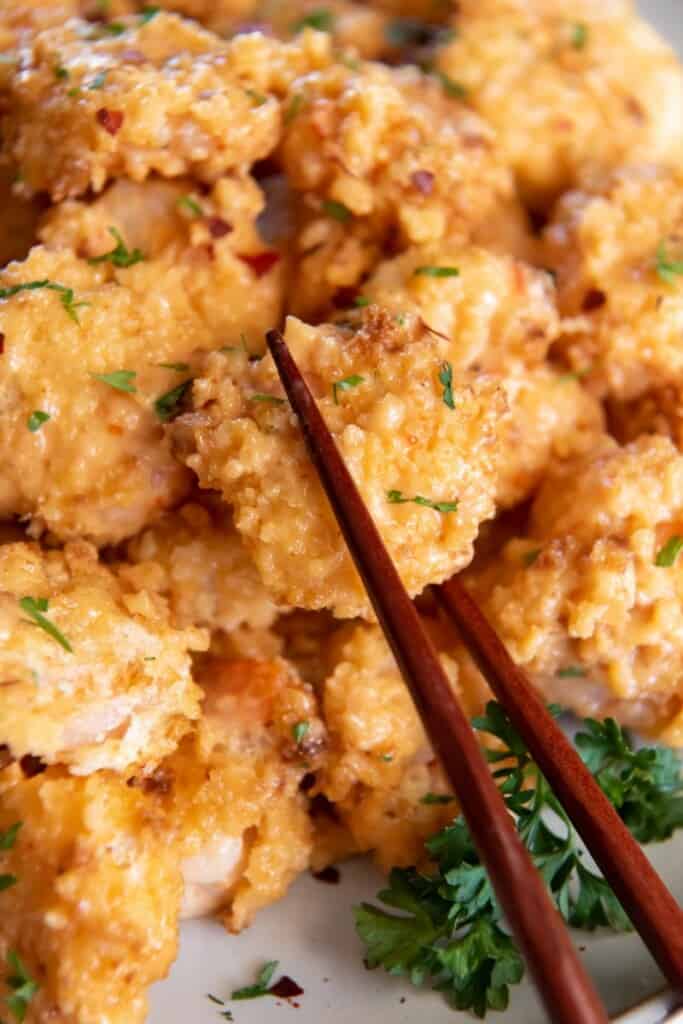 chopsticks picking up bang bang shrimp