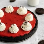 Red Velvet Oreo Cheesecake served on the springform pan with oreos around it