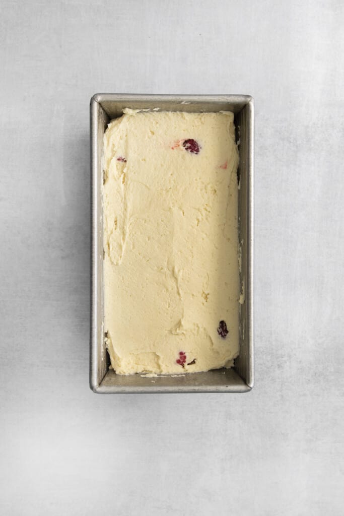 layers of cake batter and fresh berries