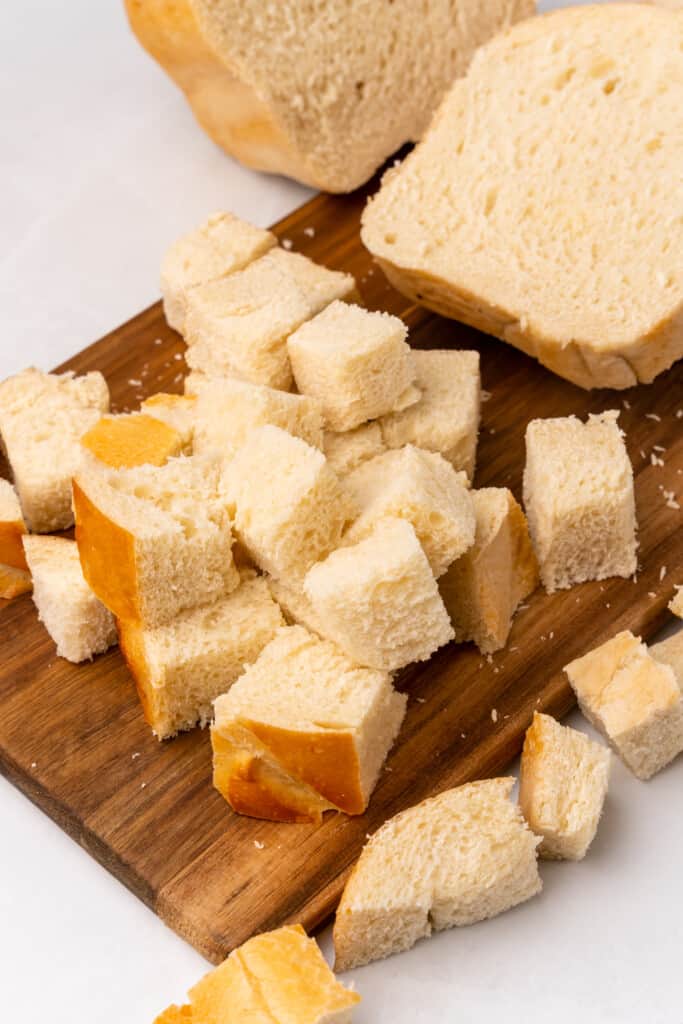 slicing bread to make croutons