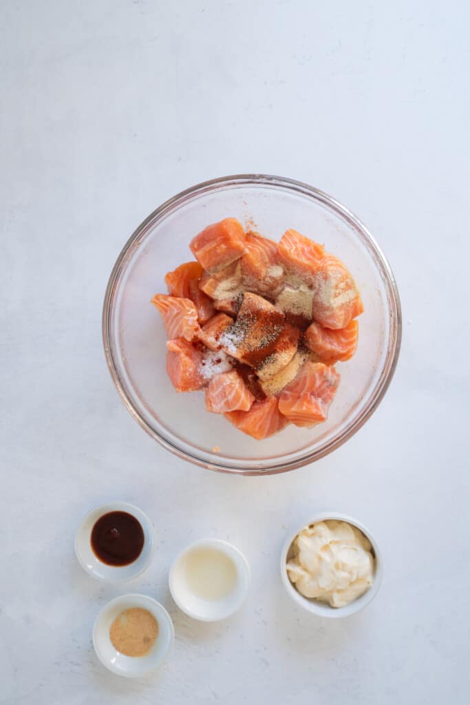adding spices to salmon