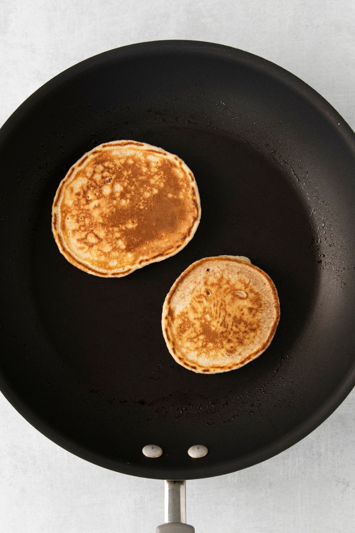 French toast pancakes on a hot griddle pan.