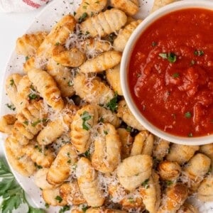 gnocci on platter with sauce