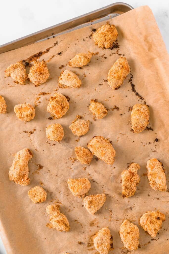 cooked chicken on a baking sheet