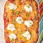 overhead view of the taco lasagna with sour cream dollops and green onions on top