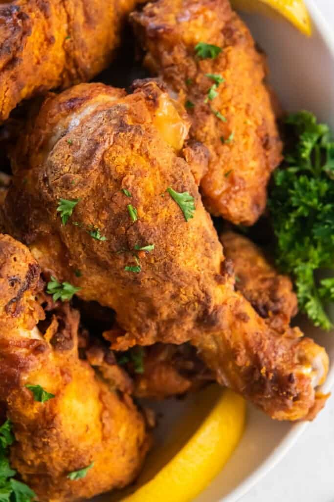 Closeup of fried chicken drumstick that was reheated in the air fryer