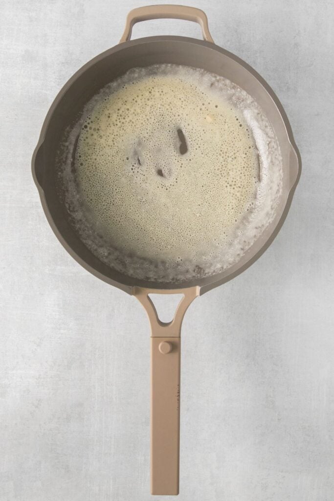 A pot making a roux to make mac and cheese with no milk.