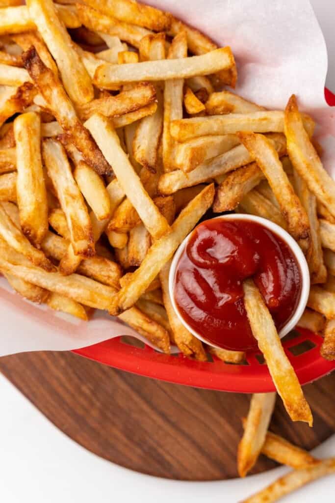 dipping fry into ketchup