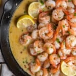 shrimp scampi with lemon wedges