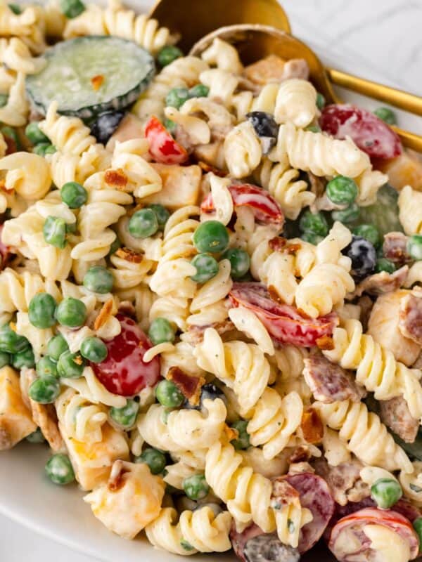 Closeup to see the pasta salad with bacon and ranch in a serving bowl.