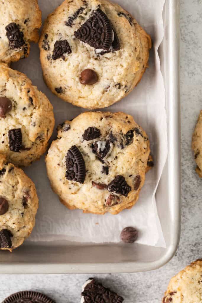 Oreo cheesecake cookies recipe up close on a baking sheet with parchment paper.